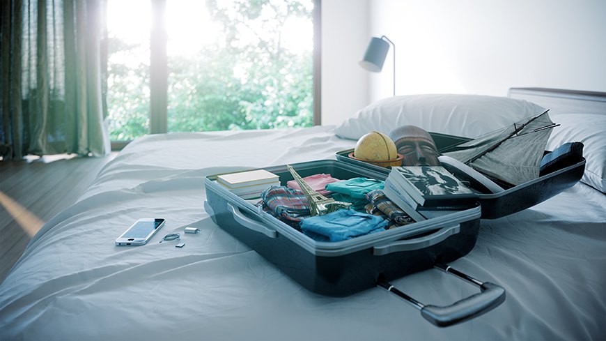 Für den Urlaub gepackter Koffer: Ist auch im Büro alles geregelt?